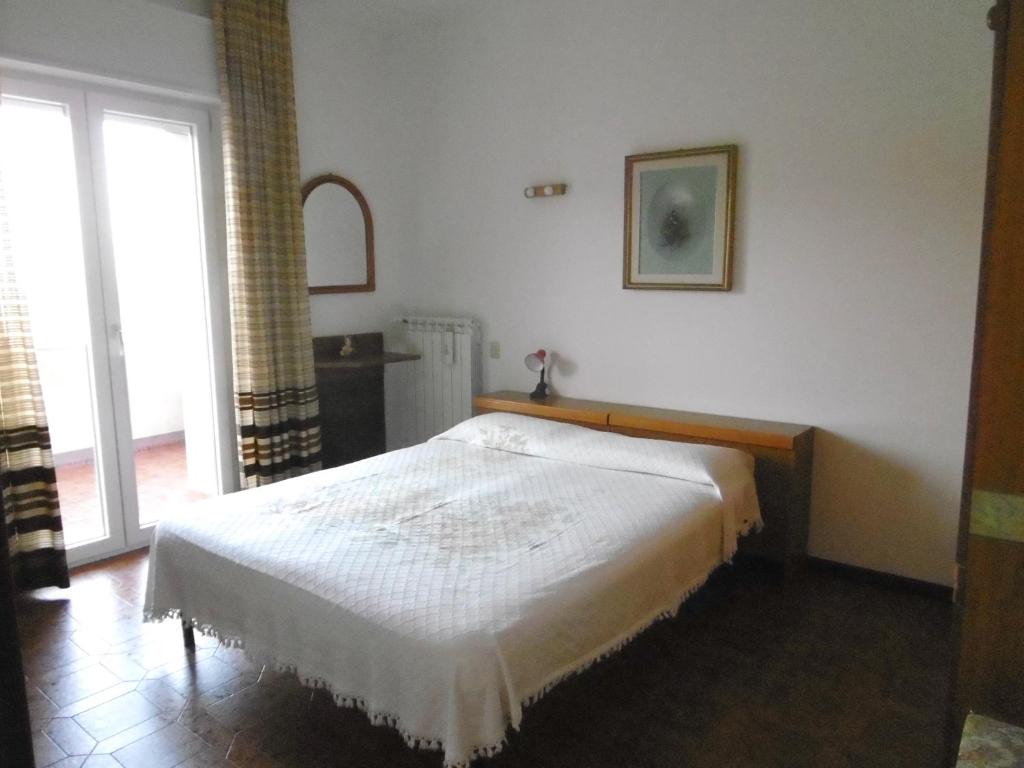 Postel nebo postele na pokoji v ubytování Cinzia House