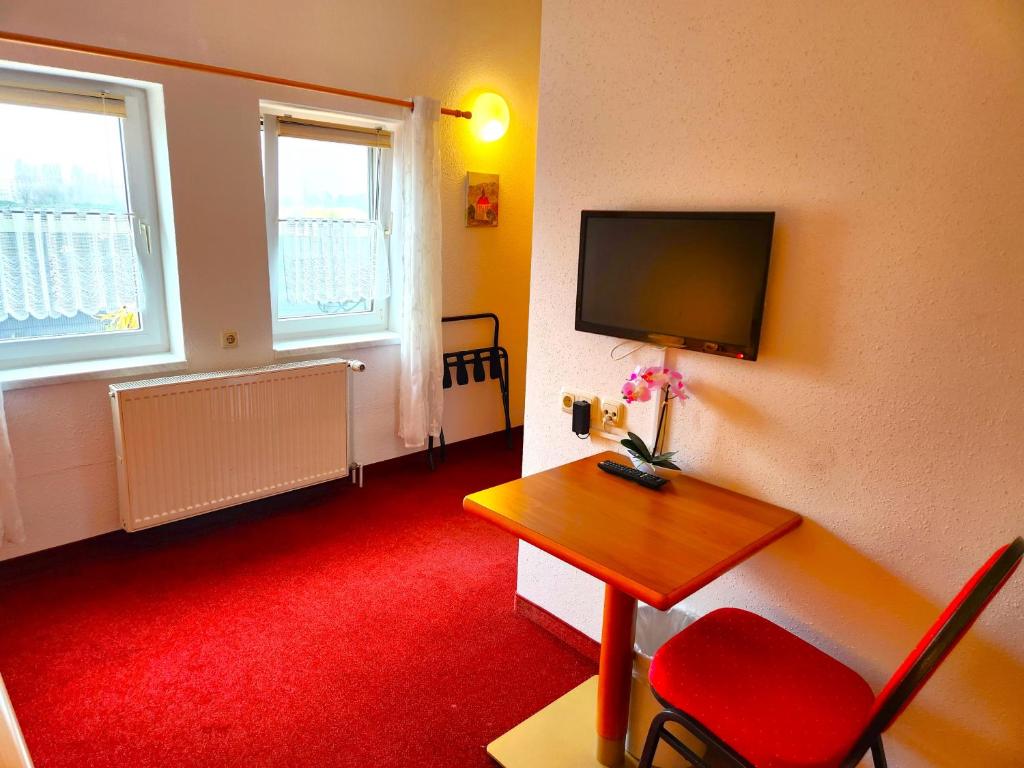 TV a/nebo společenská místnost v ubytování Pension Blümchen am Kiesgrube