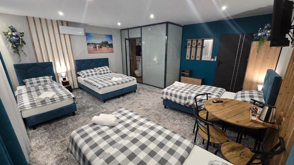 Postel nebo postele na pokoji v ubytování Pensjonat Lubianka