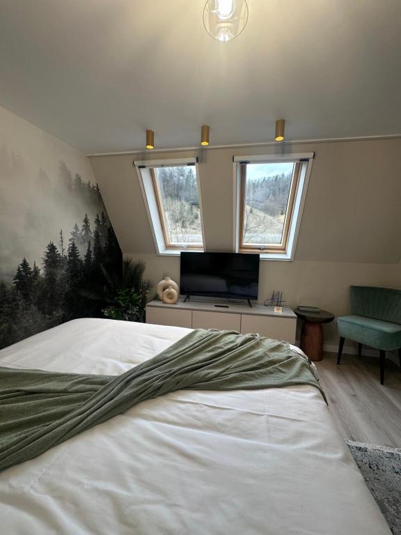 Postel nebo postele na pokoji v ubytování Alpin Heaven