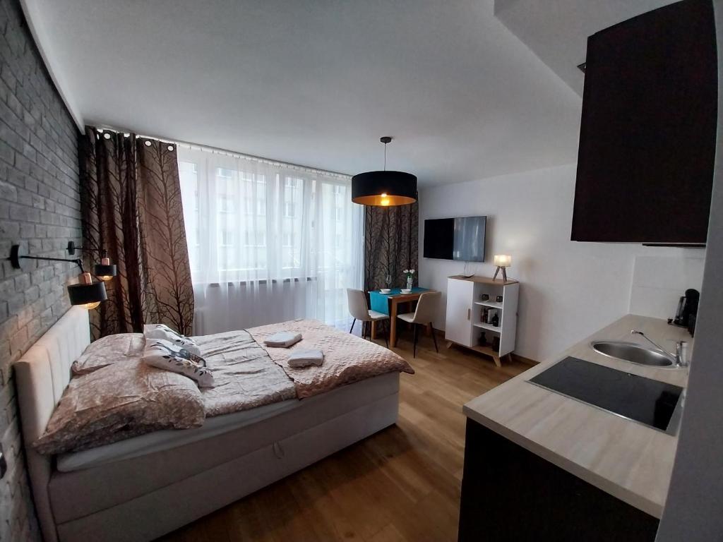 Ένα ή περισσότερα κρεβάτια σε δωμάτιο στο Studio Orla Chata