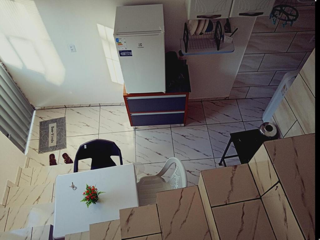 a room with boxes on the floor and a chair at Apartamento Cavalcante in Belém