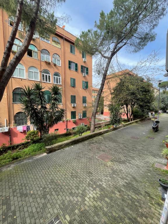 an empty street in front of a building at Rome to You- Easy way Apartment in Rome