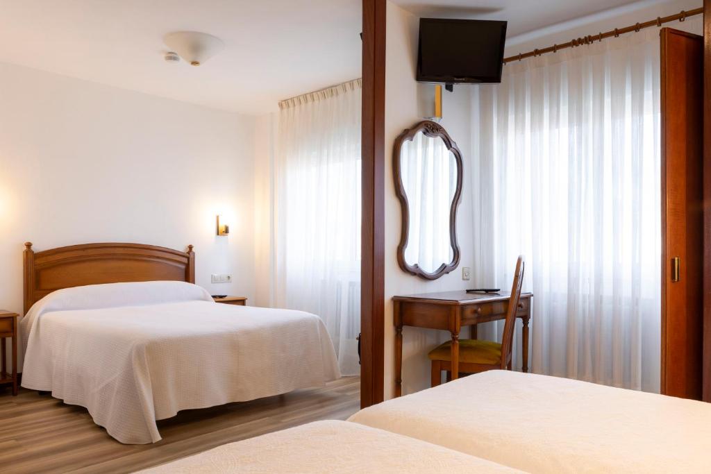 Postel nebo postele na pokoji v ubytování Hotel Cabeza