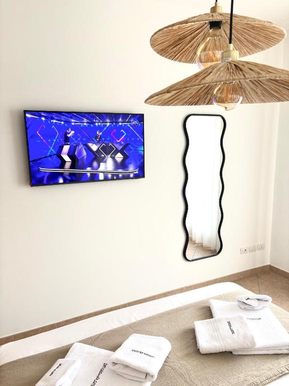 TV a/nebo společenská místnost v ubytování DImORA sALAmAC
