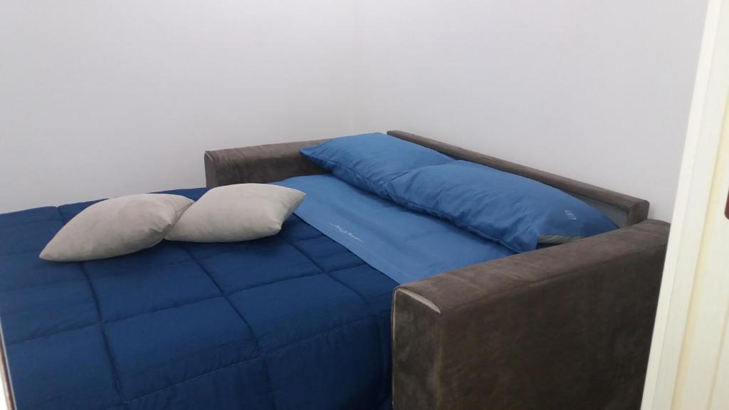 Postel nebo postele na pokoji v ubytování L'Angolo del Salento