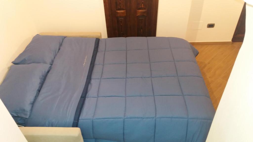Postel nebo postele na pokoji v ubytování L'Angolo del Salento