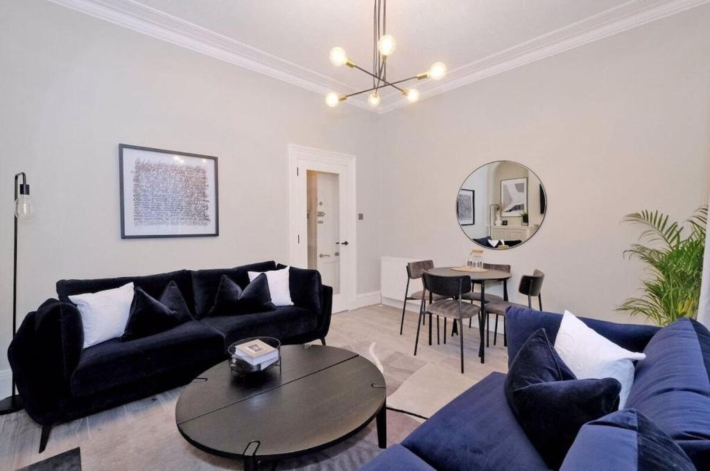 a living room with a couch and a table at Granton Place in Aberdeen