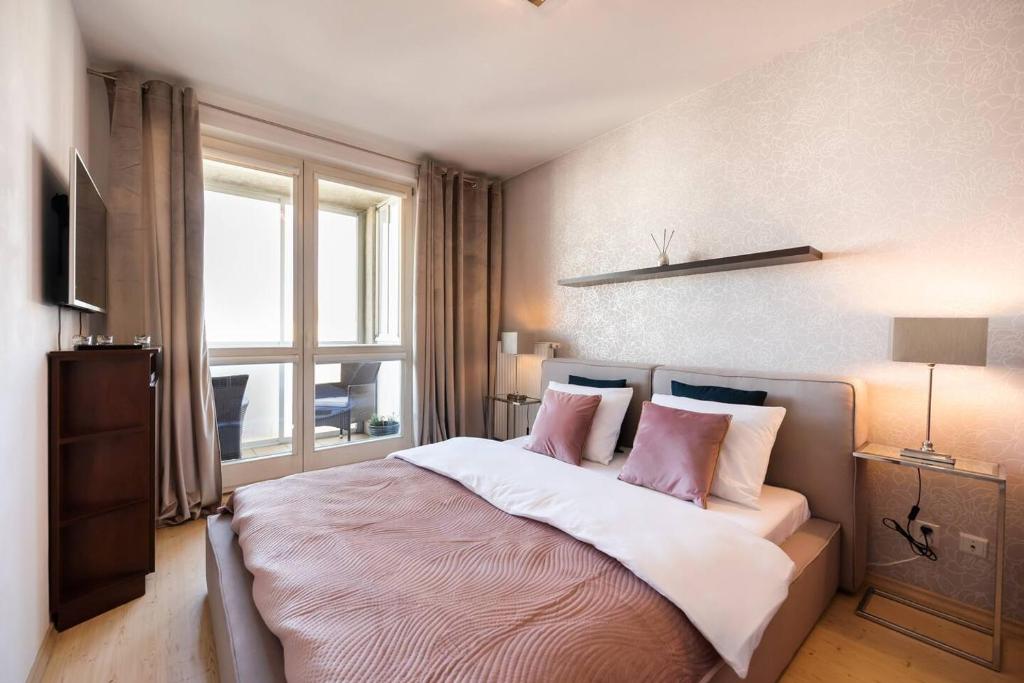 Postel nebo postele na pokoji v ubytování Apartament Zielone Zacisze