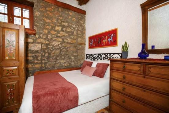 Posteľ alebo postele v izbe v ubytovaní MARIOLATA STONE HOUSE