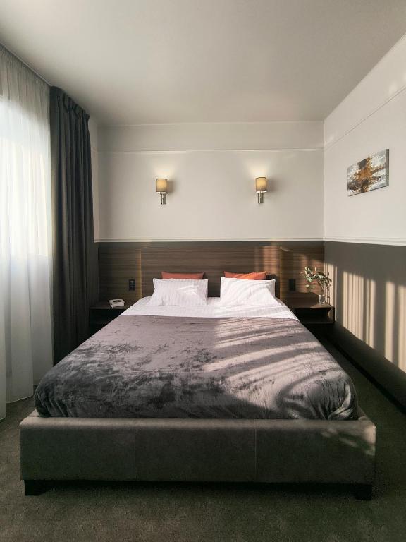 Postel nebo postele na pokoji v ubytování Mini Hotel on Brovarskaya