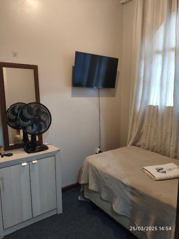 TV a/nebo společenská místnost v ubytování Quarto FIRST CLASS