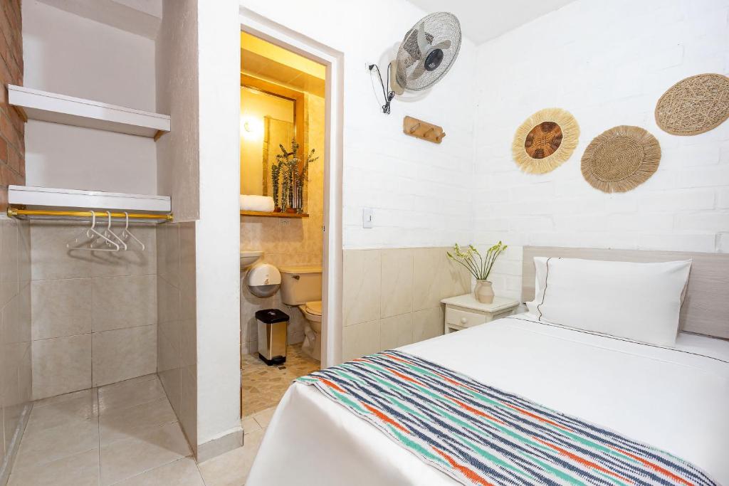 Postel nebo postele na pokoji v ubytování Gran Caribe Hotel