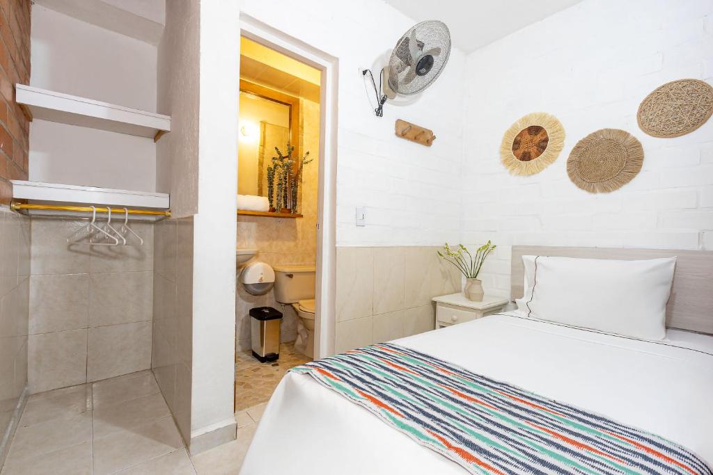 Postel nebo postele na pokoji v ubytování Gran Caribe Hotel