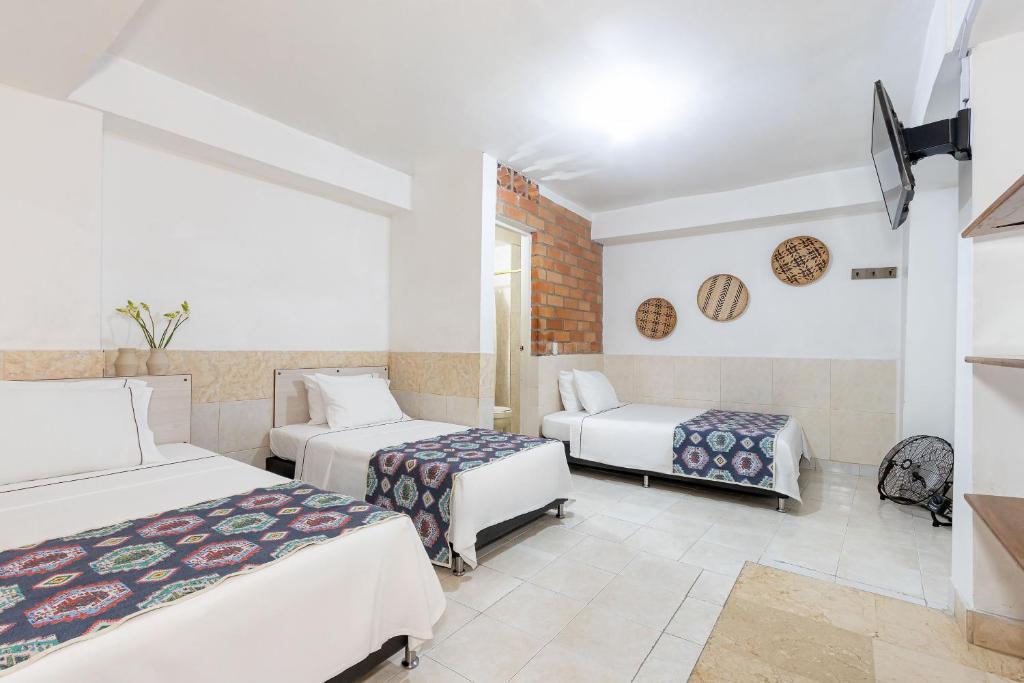 Postel nebo postele na pokoji v ubytování Gran Caribe Hotel