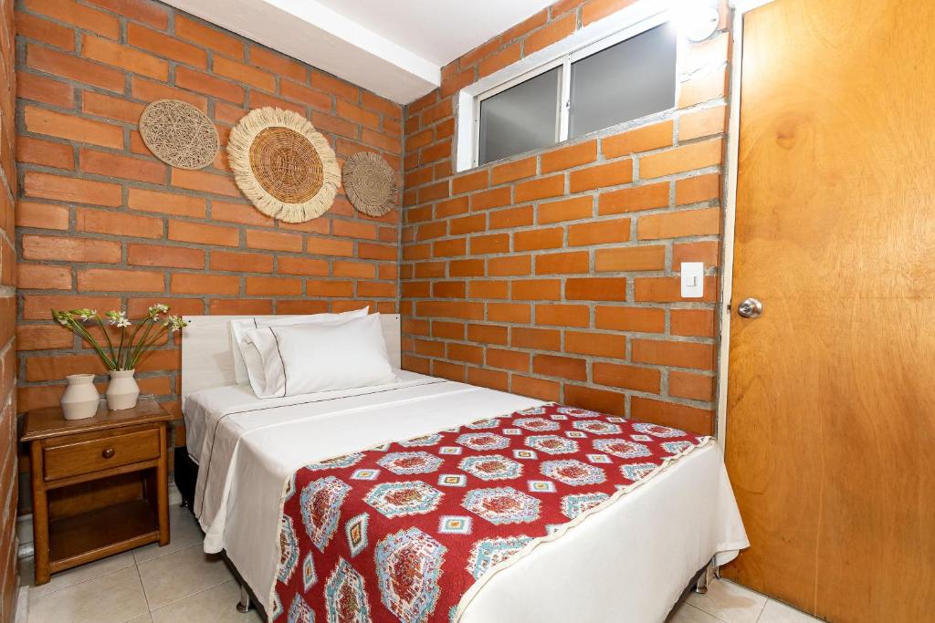 Postel nebo postele na pokoji v ubytování Gran Caribe Hotel
