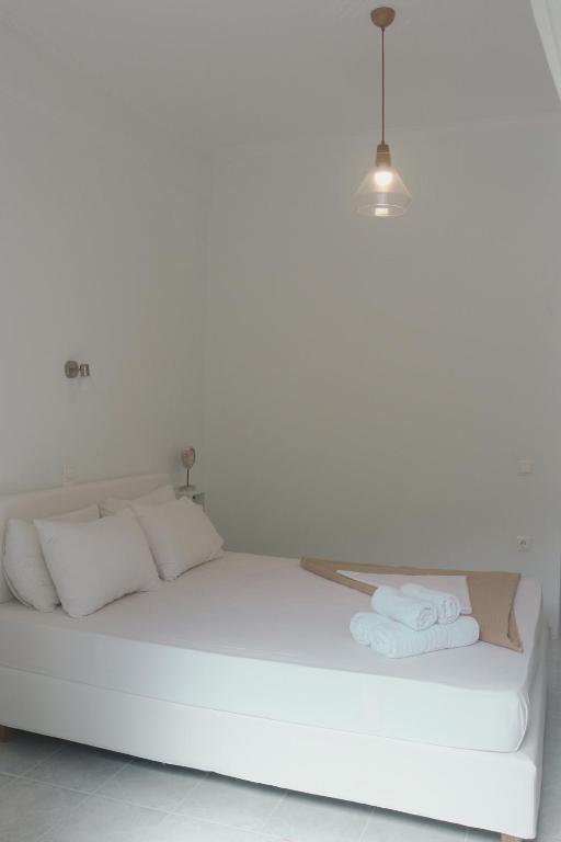 Postel nebo postele na pokoji v ubytování Kondilw Rooms