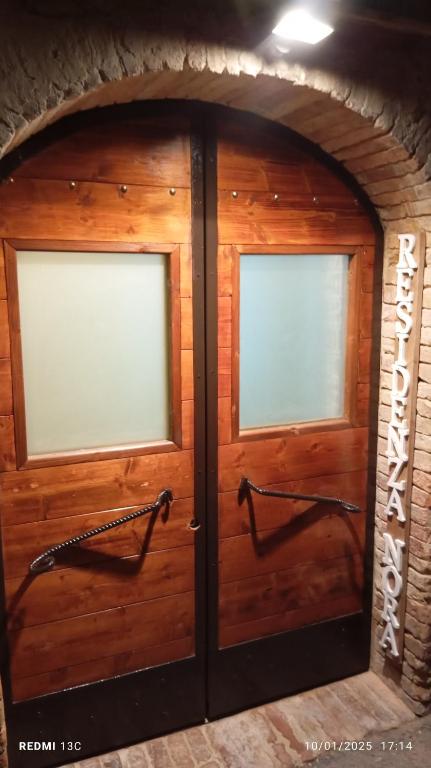 a pair of double doors in a garage at Residenza Nora in Bevagna