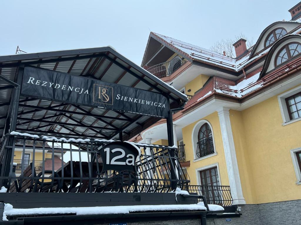 a building with a sign in front of it at Katmandu in Zakopane