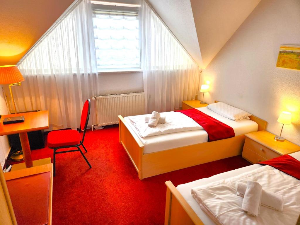 Postel nebo postele na pokoji v ubytování Pension Blümchen am Kiesgrube
