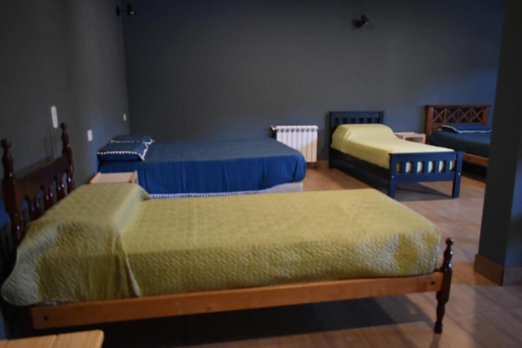 Postel nebo postele na pokoji v ubytování Raíces Hospedaje