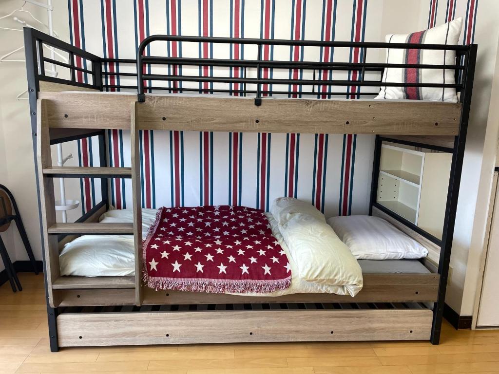 a couple of bunk beds with pillows on them at YS Minami Miyazaki No, 901 - Vacation STAY 18876 in Miyazaki