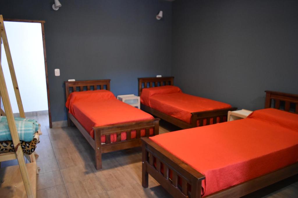 Postel nebo postele na pokoji v ubytování Raíces Hospedaje