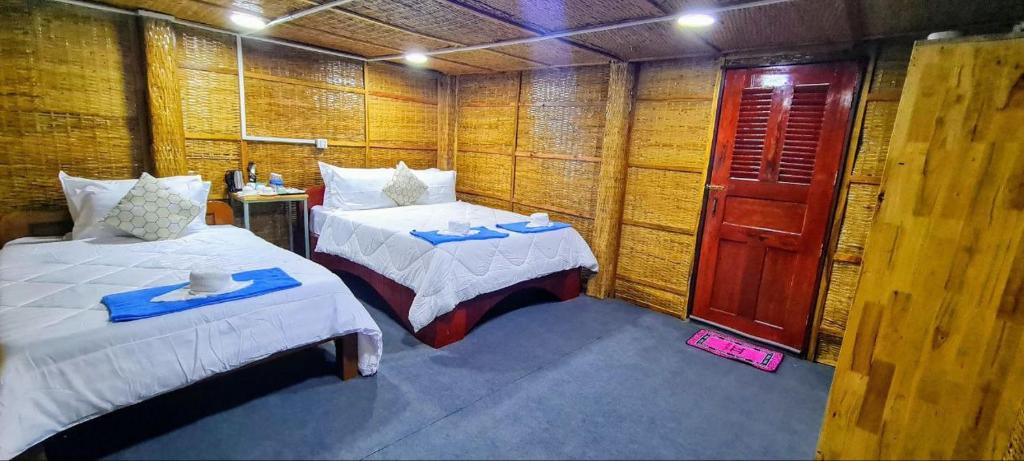 Postel nebo postele na pokoji v ubytování Europe Enchanted Bungalow Koh Rong