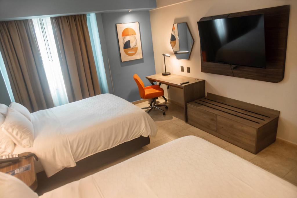 TV a/nebo společenská místnost v ubytování Holiday Inn Express Tapachula by IHG