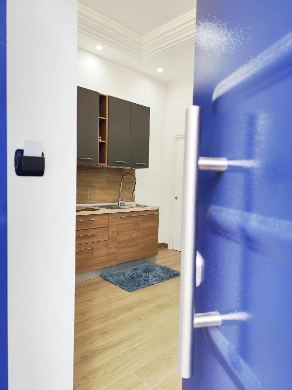 an open door to a kitchen with a sink at Maria Grazia's House in Ercolano