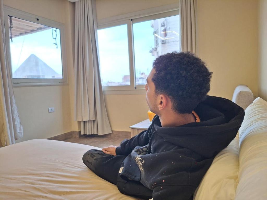 Postel nebo postele na pokoji v ubytování Hassan Pyramids Hotel