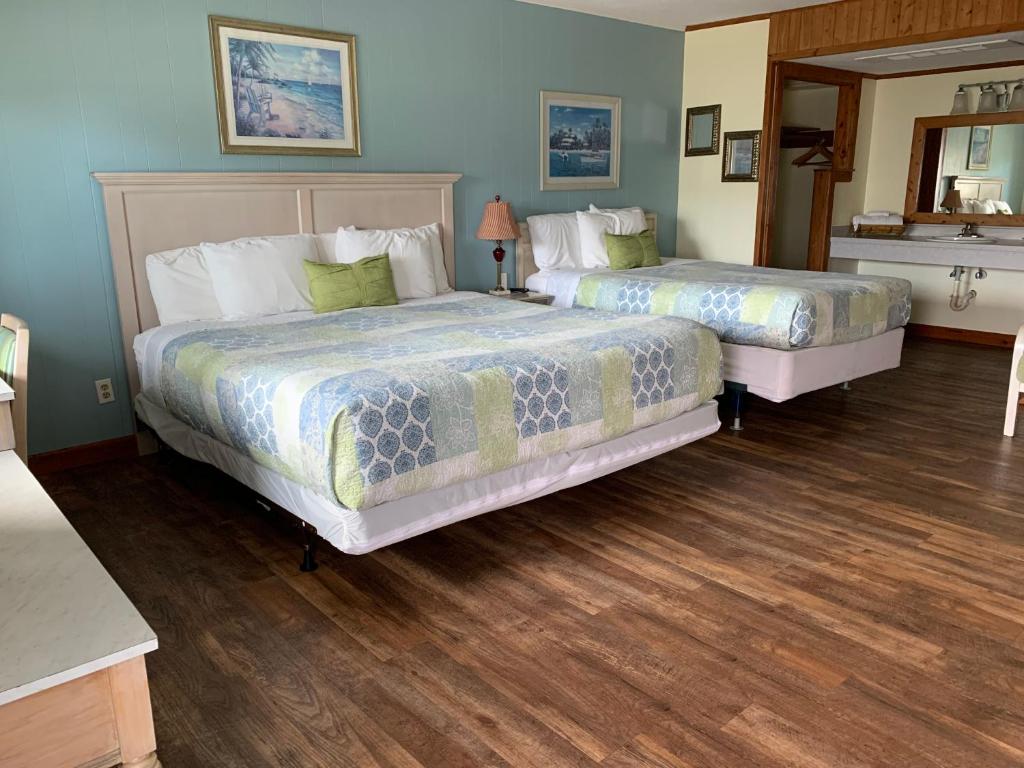 Postel nebo postele na pokoji v ubytování Cape Pines Motel