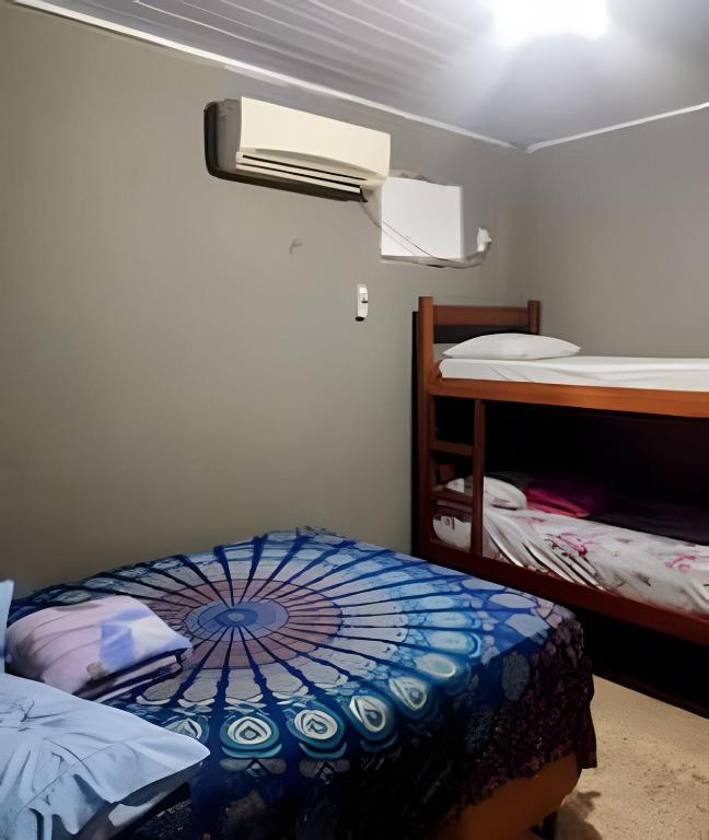 Postel nebo postele na pokoji v ubytování Temporada no Atalaia