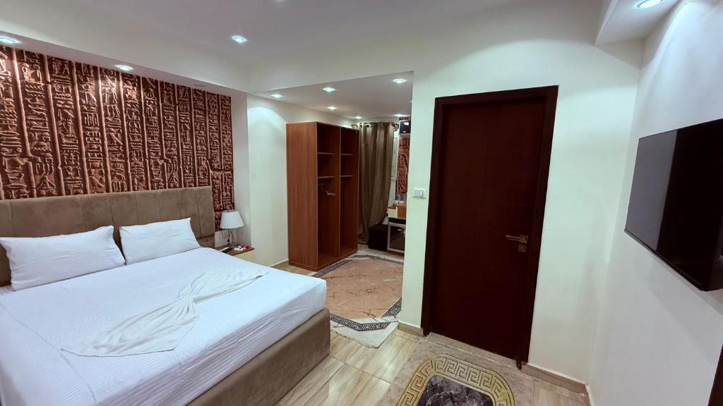 Voodi või voodid majutusasutuse Locanda pyramids view toas