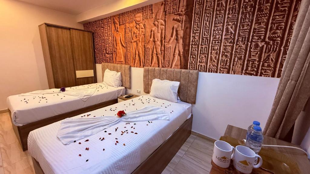 Voodi või voodid majutusasutuse Locanda pyramids view toas