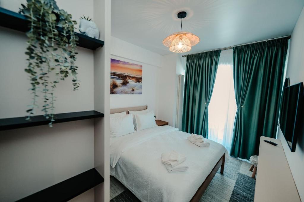 Giường trong phòng chung tại Apartament 2 camere Mamaia Nord