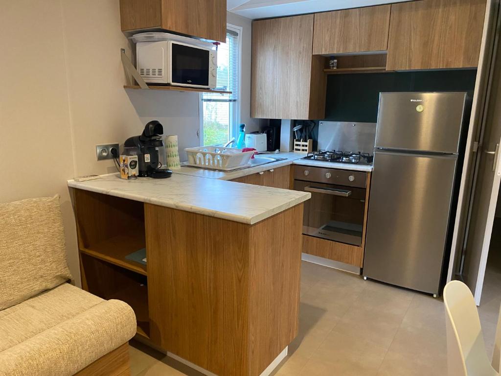Kuchyň nebo kuchyňský kout v ubytování Mobil home 55 -8 personnes