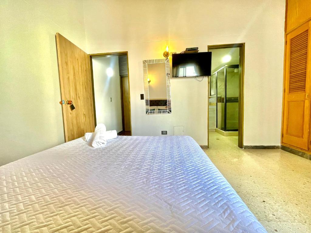 Postel nebo postele na pokoji v ubytování Hotel Torre Primavera