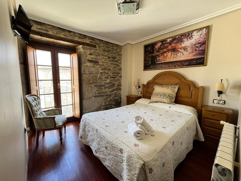 Posteľ alebo postele v izbe v ubytovaní Hotel Casa Alberto