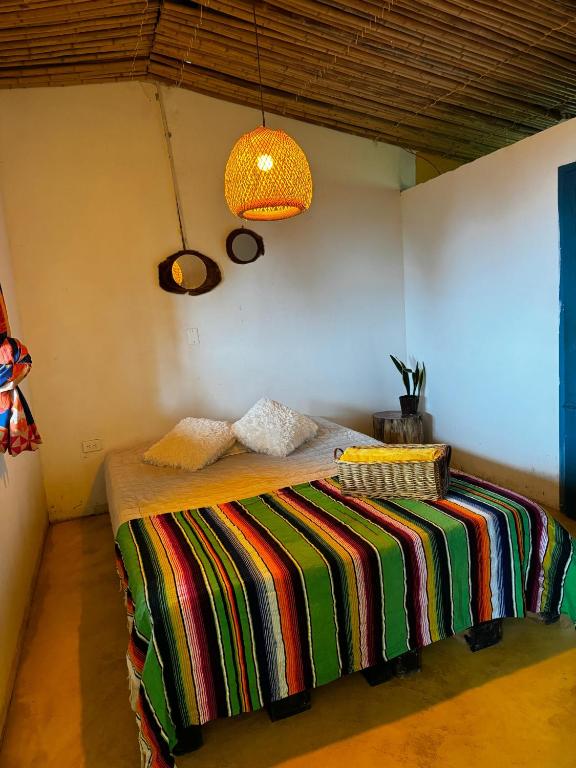 Postel nebo postele na pokoji v ubytování Casa Mostaza-Ecolodge