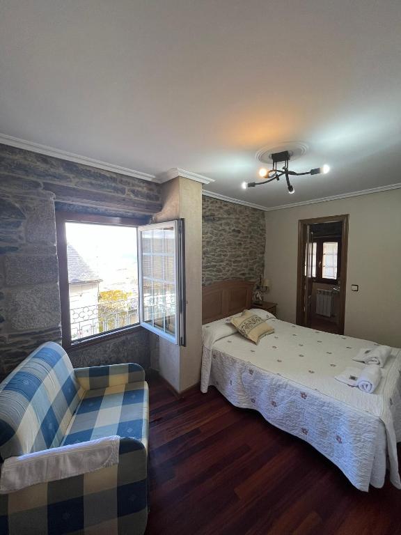 Posteľ alebo postele v izbe v ubytovaní Hotel Casa Alberto