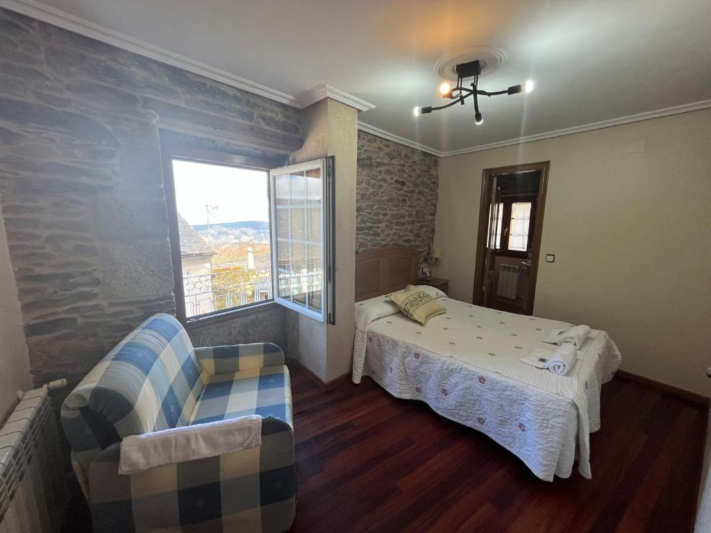 Posteľ alebo postele v izbe v ubytovaní Hotel Casa Alberto