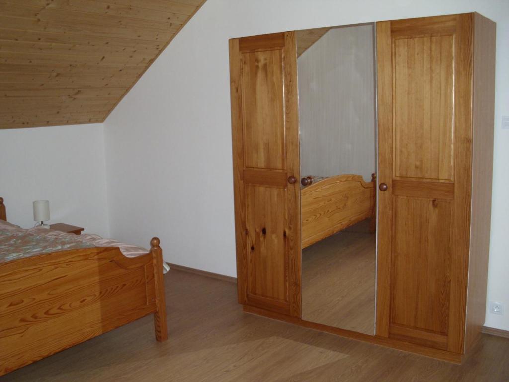 Postel nebo postele na pokoji v ubytování Apartmány nad Otavou