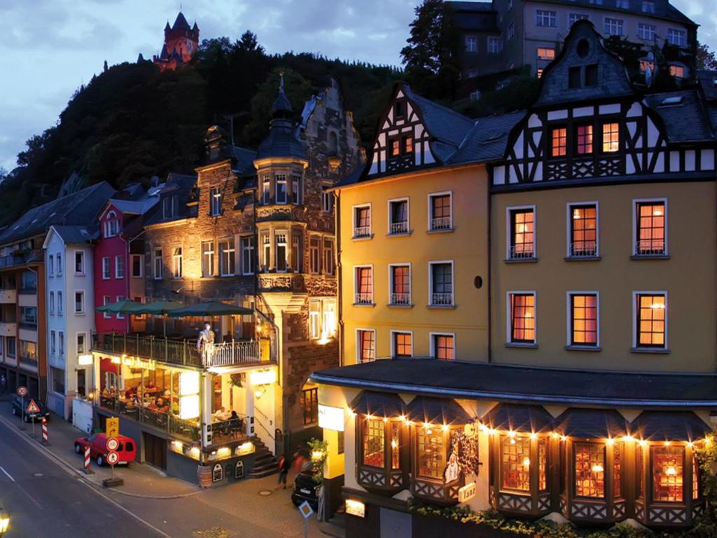 a group of buildings in a town at night at Hotel Weinhof in Cochem