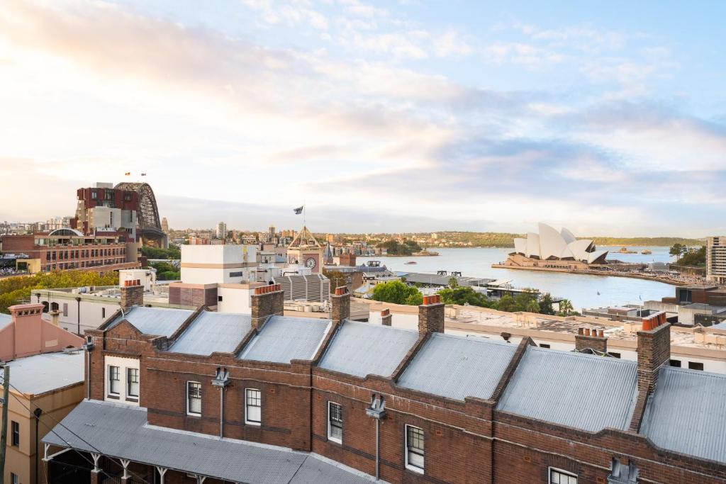 a view of the sydney city skyline with the opera house at YHA Sydney Harbour in Sydney