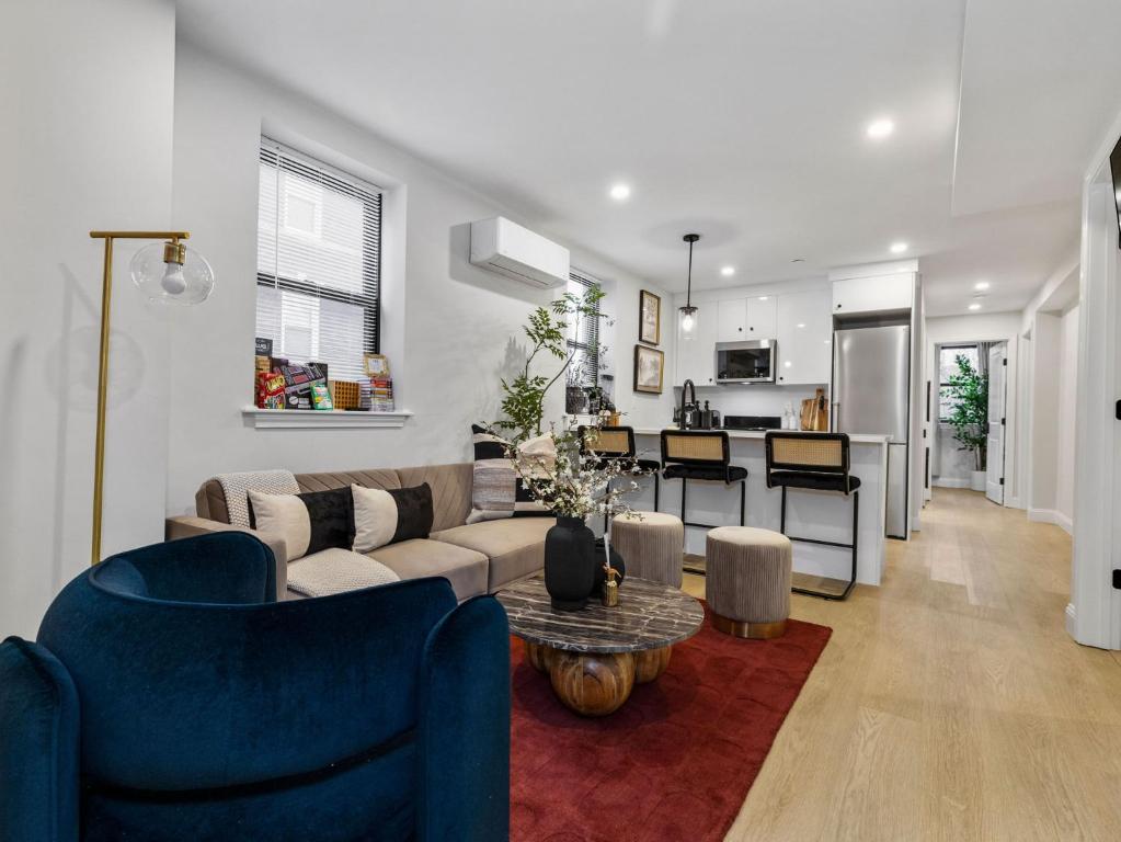 a living room with a couch and a table at North End Apt close to TD Garden Walk to Downtown in Boston