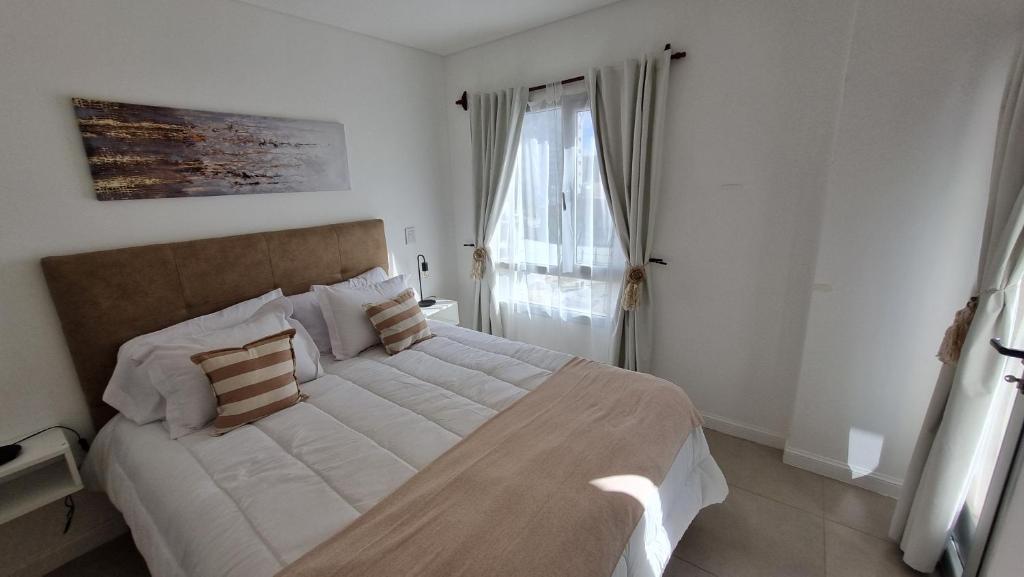 Giường trong phòng chung tại Costa Bonita