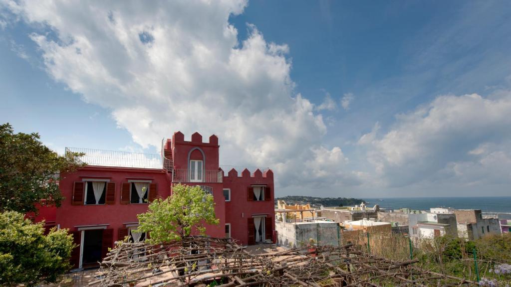 a red building on top of a city at Albergo 'La Vigna' in Procida