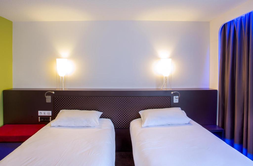 Postel nebo postele na pokoji v ubytování ibis Styles Lorient Caudan