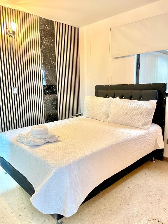 Postel nebo postele na pokoji v ubytování Hotel Torre Primavera